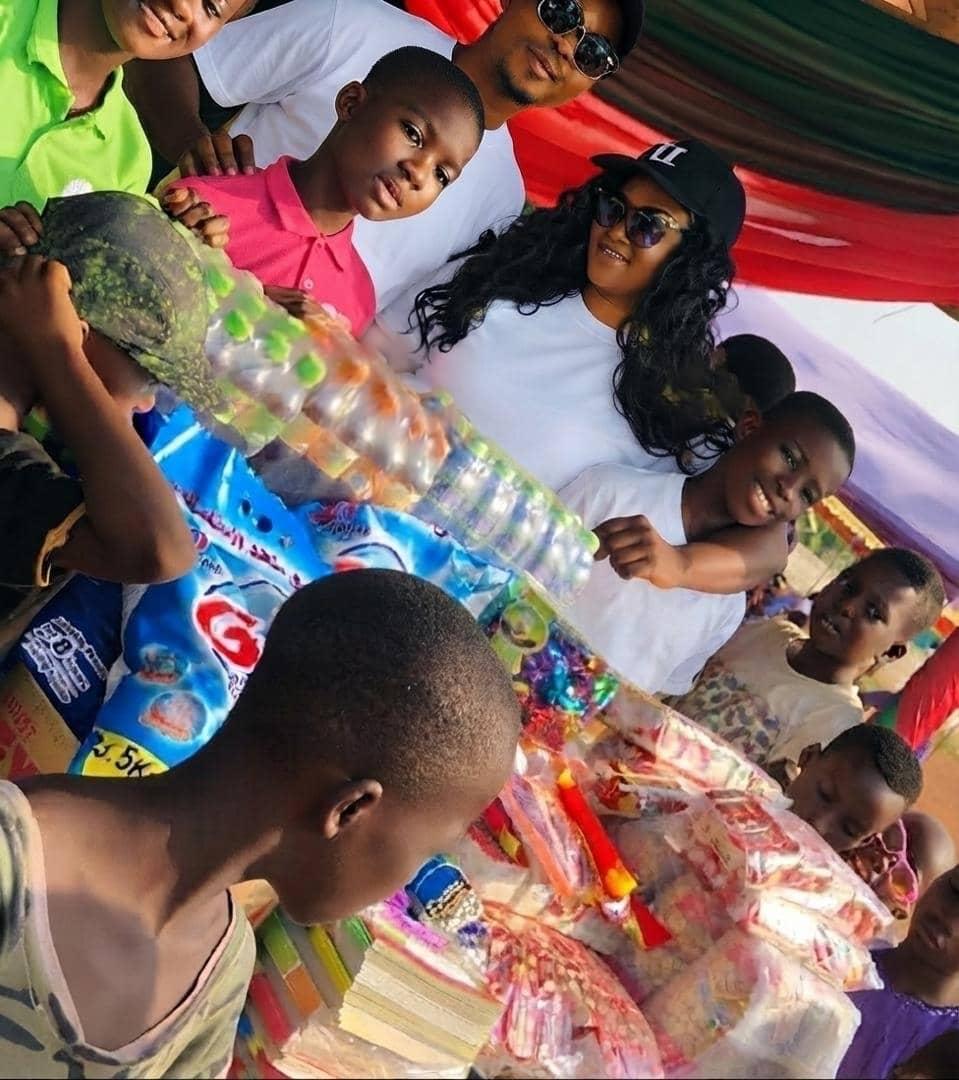 Children receiving donated supplies at an orphanage visit