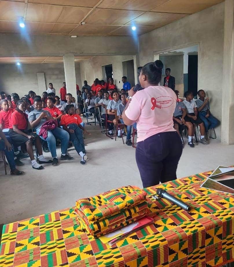 UEWG facilitator addressing students during a breast cancer awareness talk